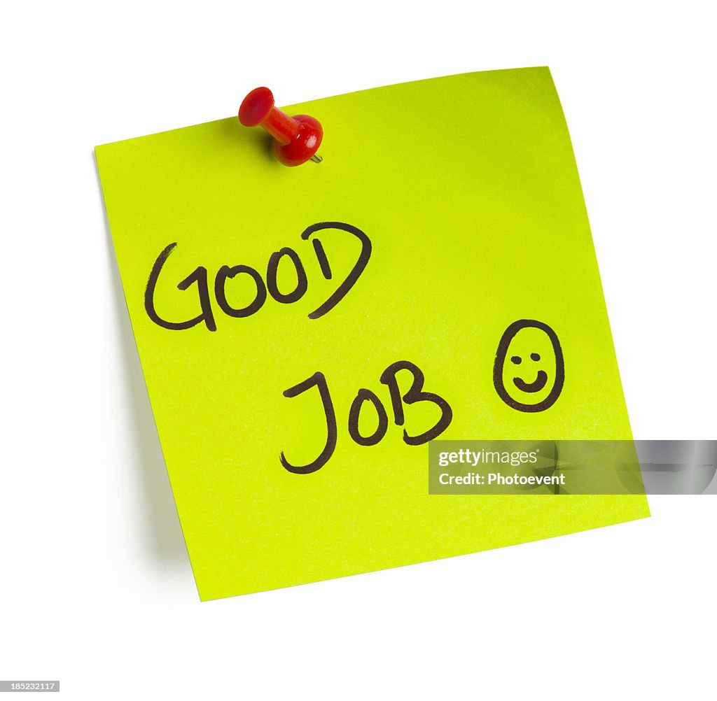 A post it note that says good job