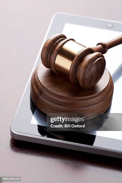 gavel & digital tablet - code of conduct stock pictures, royalty-free photos & images