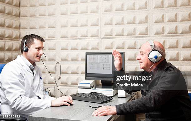 hearing test - ear exam stock pictures, royalty-free photos & images