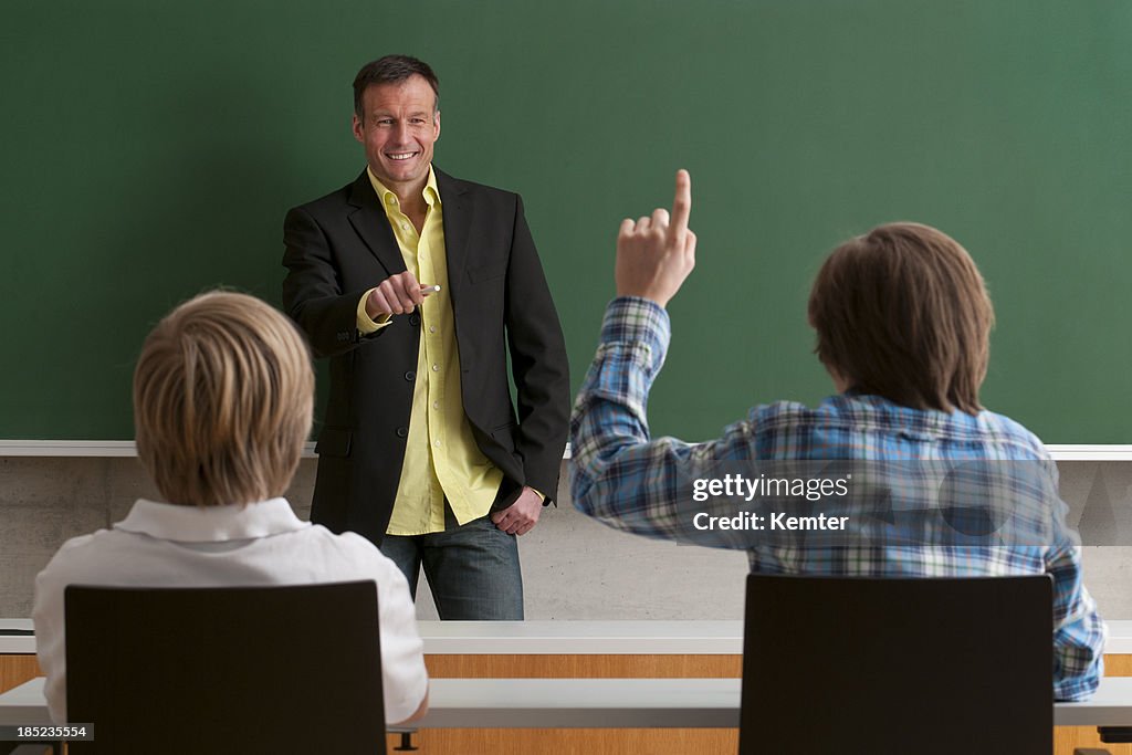 Teacher talking with students