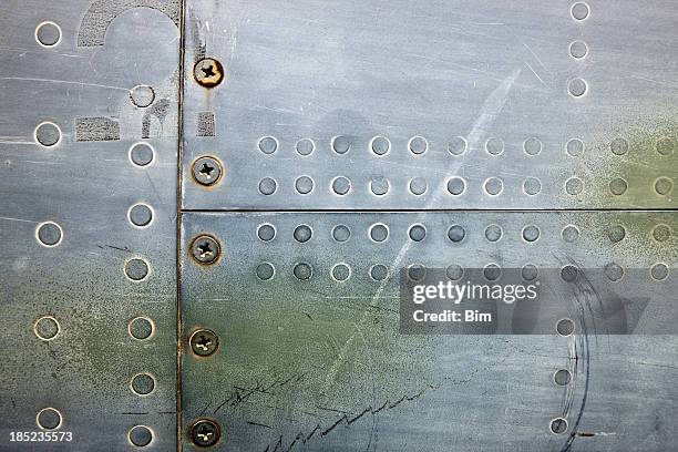 metal xxxl background with rivets and screws - nit arbetsverktyg bildbanksfoton och bilder