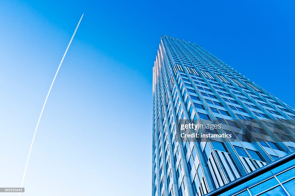 Eurotower with blue sky and jet trail