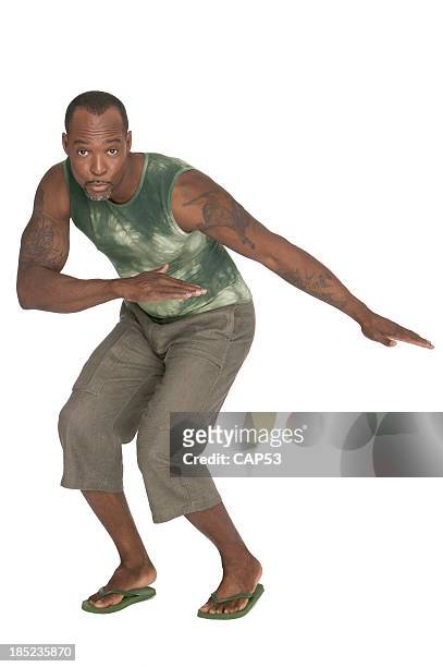 black man surfing on white background - bermuda people stock pictures, royalty-free photos & images