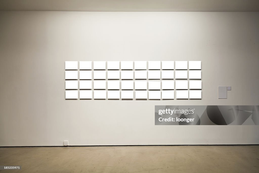 Group of blank frames on the wall at art gallery