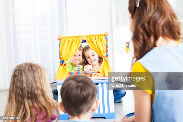 preschool: preschoolers craft activities puppet show. - puppet show stock pictures, royalty-free photos & images