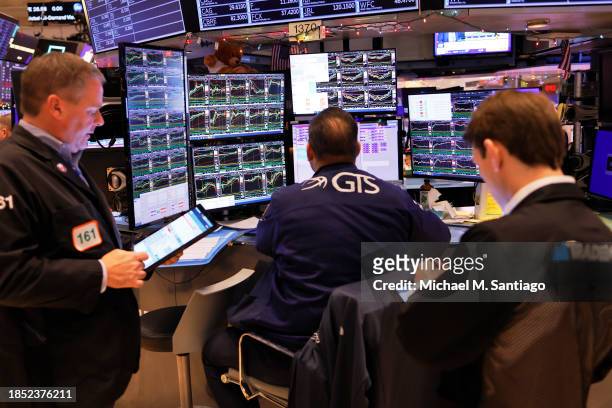 Traders work on the floor of the New York Stock Exchange during morning trading on December 13, 2023 in New York City. Stocks opened up mixed amid...