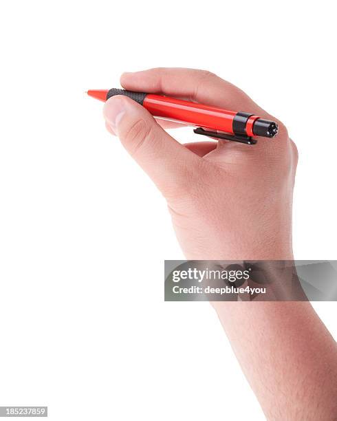 writing male hand with red pen on white - balpen stockfoto's en -beelden