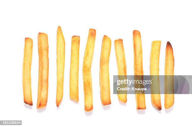 french fries in a row on white background - french fries stock pictures, royalty-free photos & images