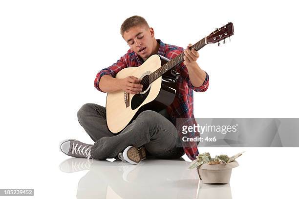 street musician with a guitar - guitar isolated stock pictures, royalty-free photos & images