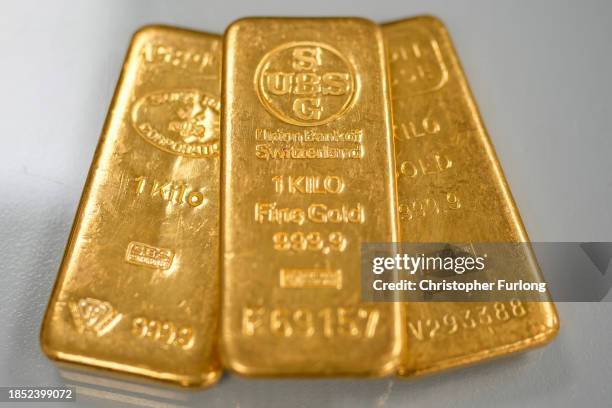 Three 1kg gold bullion bars lay on the counter in a gold dealers in Birmingham's jewellery quarter on December 13, 2023 in Birmingham, England. Gold...