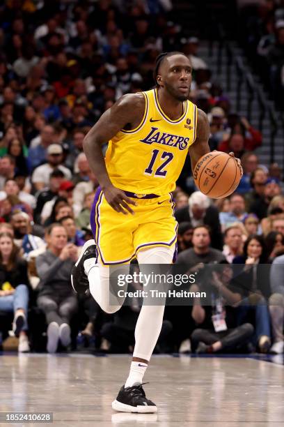 Taurean Prince of the Los Angeles Lakers dribbles the ball against the Dallas Mavericks in the first half at American Airlines Center on December 12,...