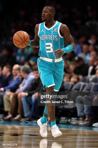 Terry Rozier of the Charlotte Hornets brings the ball up court during the first quarter of their game against the Miami Heat at Spectrum Center on...