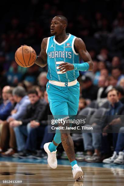 Terry Rozier of the Charlotte Hornets brings the ball up court during the first quarter of their game against the Miami Heat at Spectrum Center on...