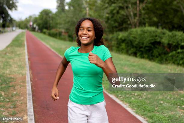 teen girl running - girls on train track stock pictures, royalty-free photos & images