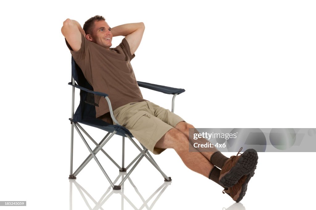 Resting In Chair Man Resting In A Folding Chair High-Res Stock Photo - Getty Images