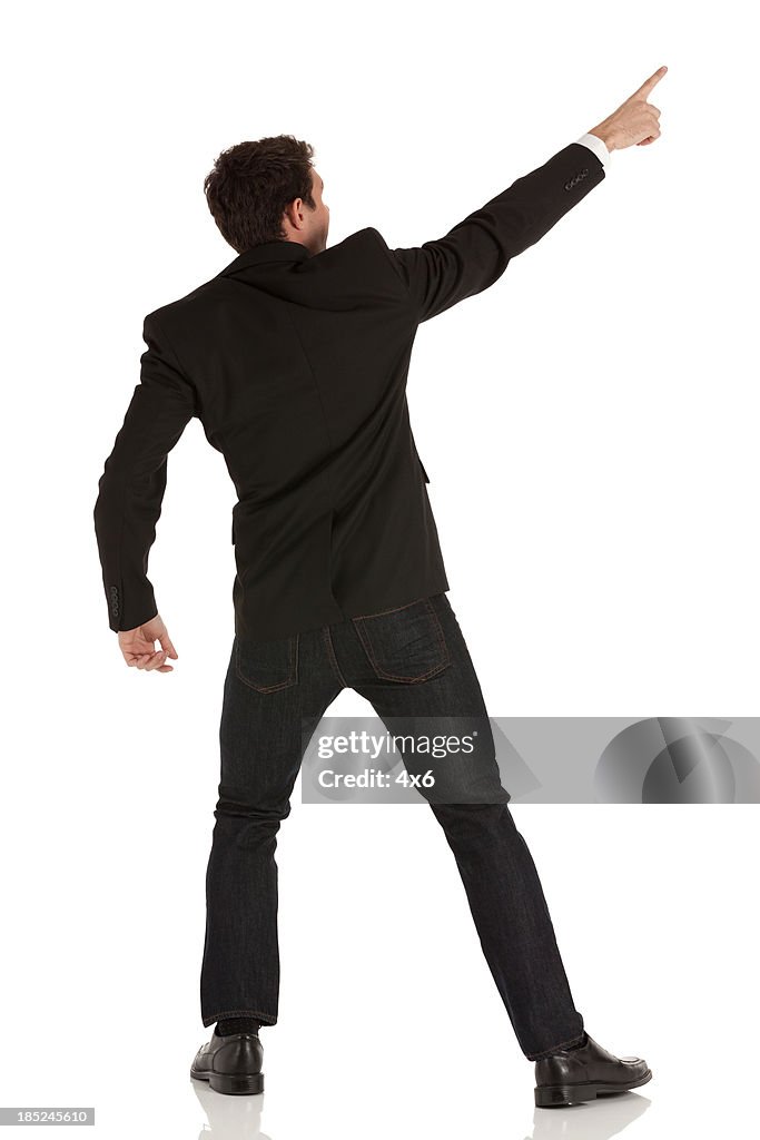Rear view of a businessman pointing
