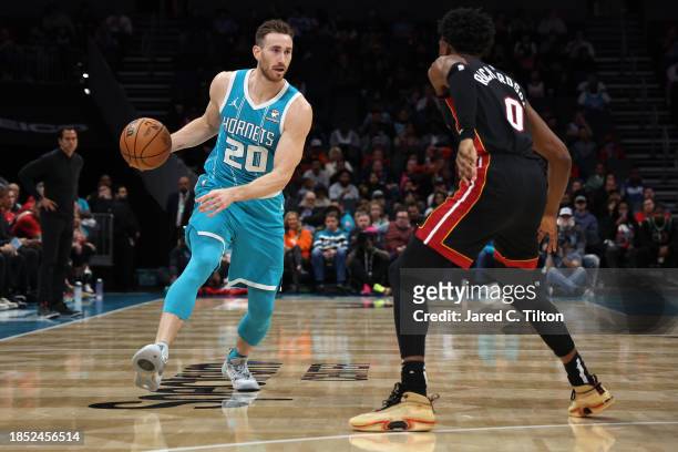 Gordon Hayward of the Charlotte Hornets dribbles while defended by Josh Richardson of the Miami Heat during the second quarter of their game at...