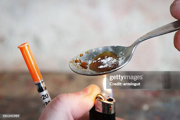 addict preparing drugs - crack spoon stock pictures, royalty-free photos & images