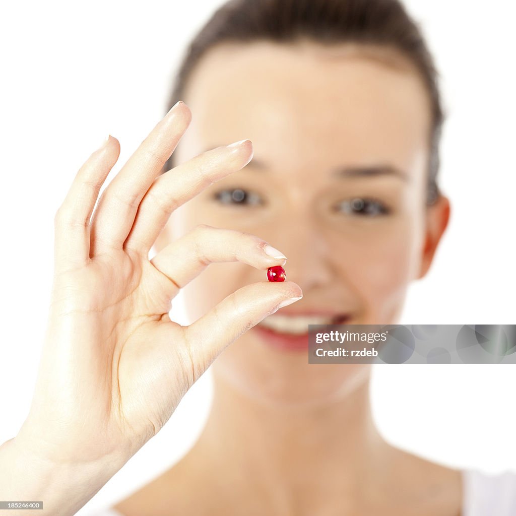 Beautiful Woman taking pill