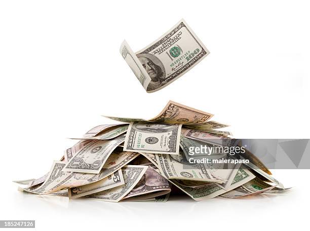 heap of money. dollar bills. - dollar bills stock pictures, royalty-free photos & images