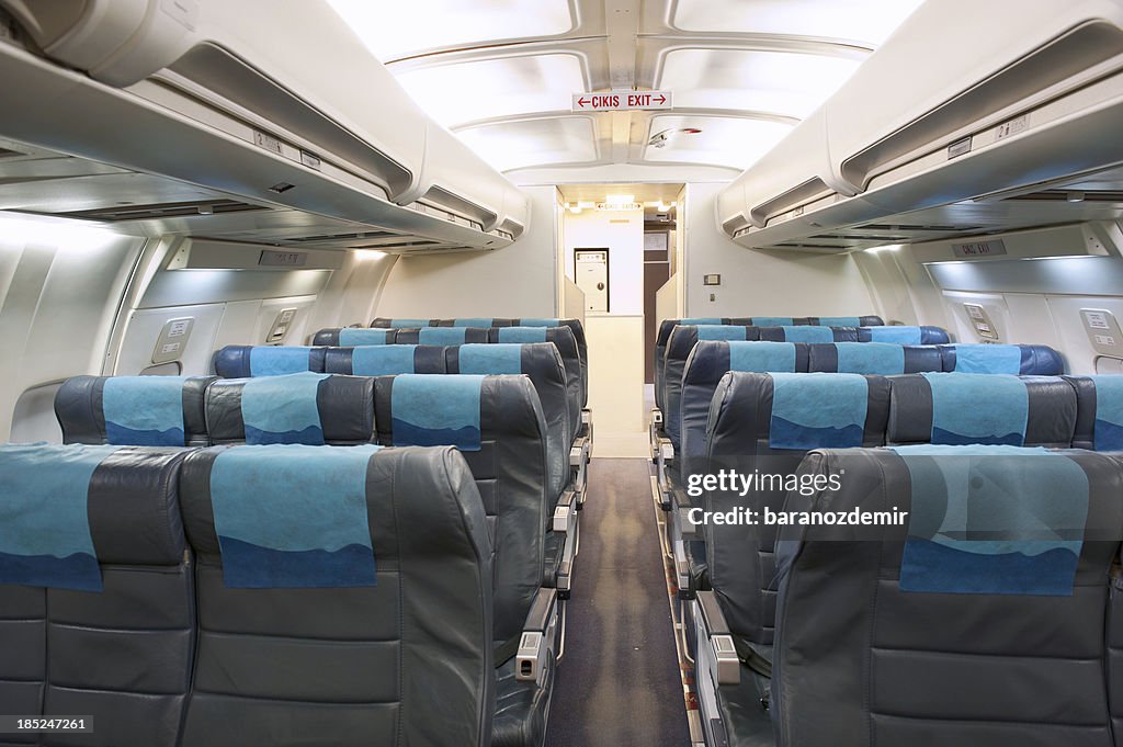 Economy Class Seating Inside An Airplane Cabin