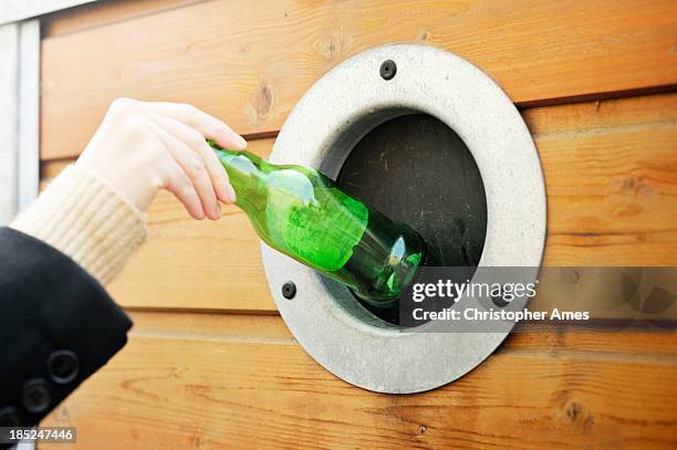 making a deposit at the bottle bank - bottle bank stock pictures, royalty-free photos & images