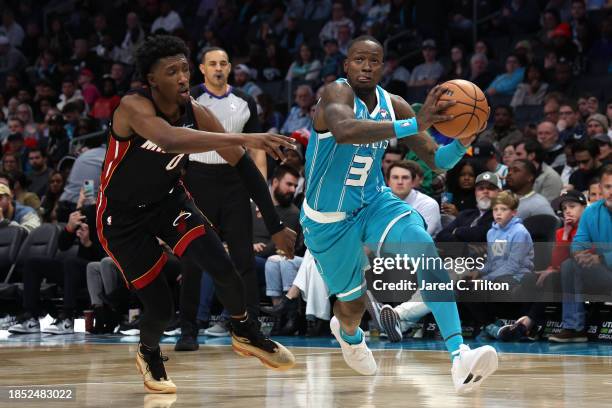 Terry Rozier of the Charlotte Hornets drives to the basket against Josh Richardson of the Miami Heat during the second quarter of their game at...