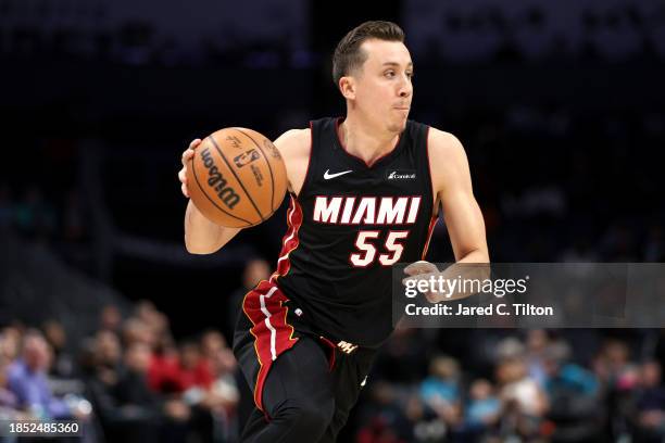 Duncan Robinson of the Miami Heat drives to the basket during the second half of their game against the Charlotte Hornets at Spectrum Center on...