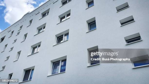 facade of renovated energy efficient public housing - certificate of ownership stock pictures, royalty-free photos & images
