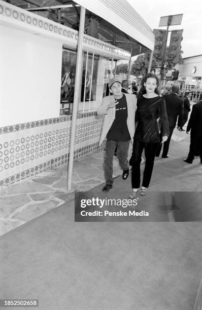 Luke Perry and Rachel Sharp attend the local premiere of "The X-Files: Fight the Future" at the Mann Village Theatre in the Westwood neighborhood of...