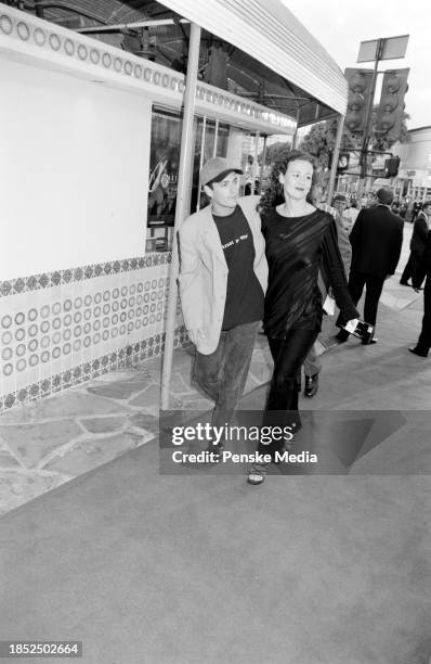 Luke Perry and Rachel Sharp attend the local premiere of "The X-Files: Fight the Future" at the Mann Village Theatre in the Westwood neighborhood of...