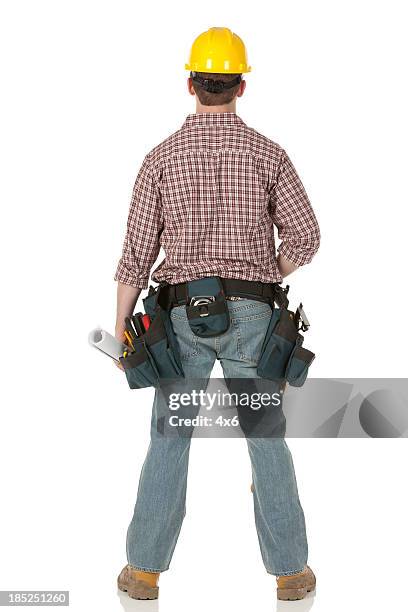 rear view of a construction worker standing - tool belt stock pictures, royalty-free photos & images