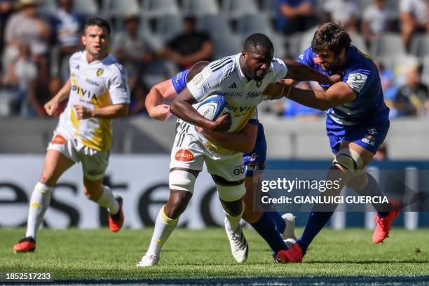 La Rochelle's Judicael Cancoriet is tackled during the European Rugby Champions Cup, Pool 4 Rugby Union match between Stormers and Stade Rochelais at...