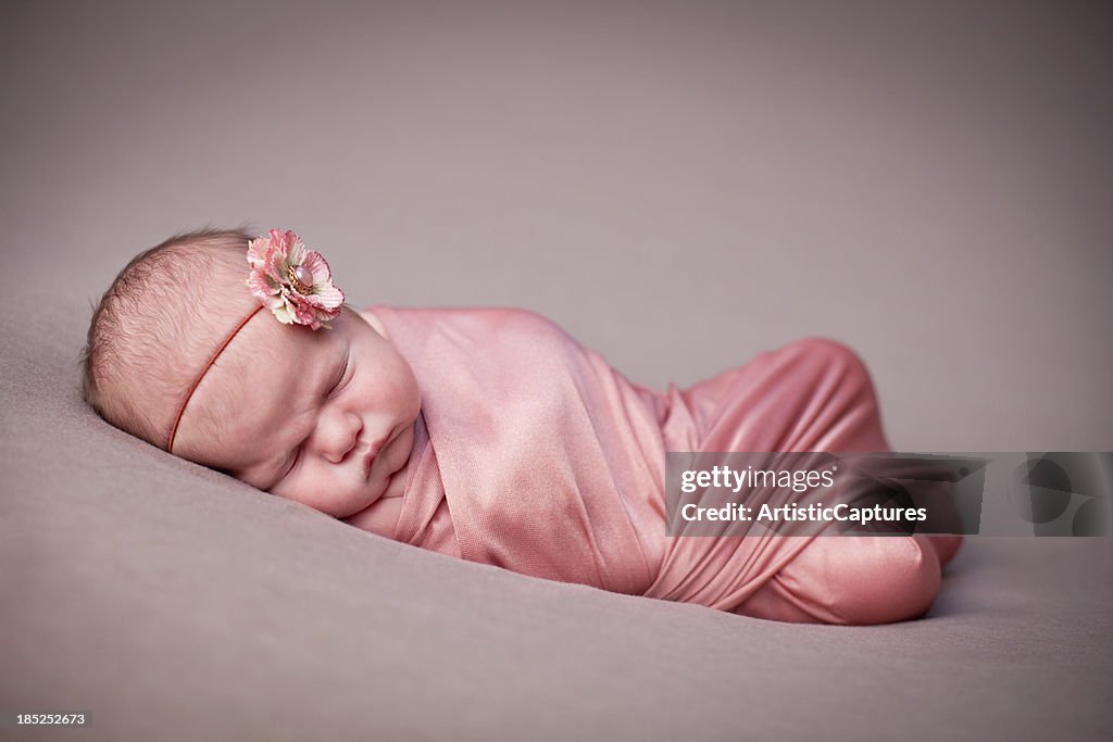 Color Image of Newborn Baby Girl Wrapped in Blanket