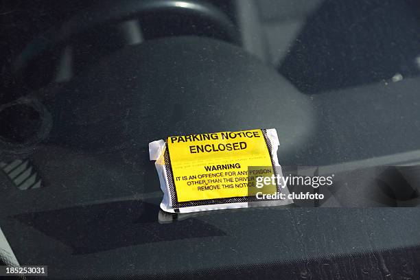 parking ticket on a car windscreen - parking violation stock pictures, royalty-free photos & images