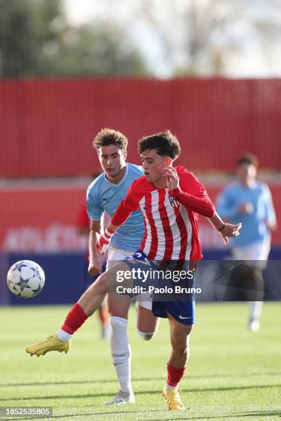 Massimo Bigotti of SS Lazio U19 competes for the ball with Javier Bonar of Atletico Madrid during the UEFA Youth League match between Atletico Madrid...