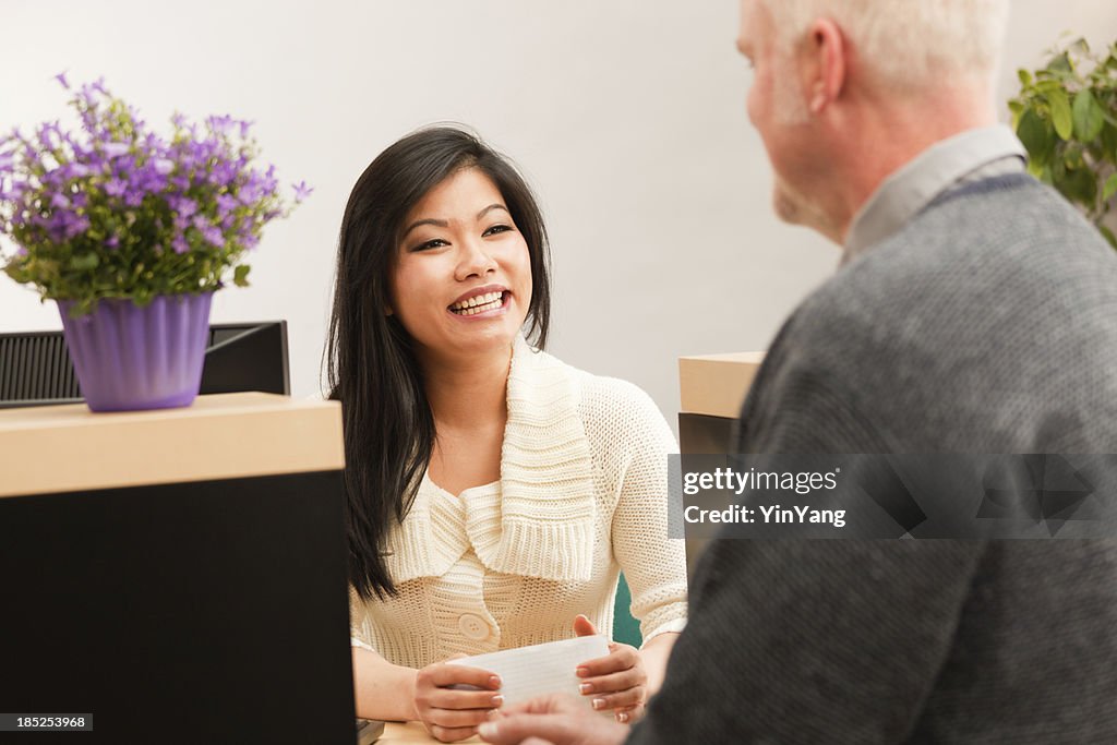 Banking Customer Making a Transaction with Bank Teller Hz