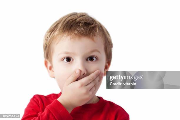 shocked boy - hands covering mouth stockfoto's en -beelden