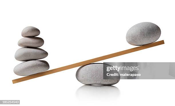 balancing stones - uneven scales stock pictures, royalty-free photos & images