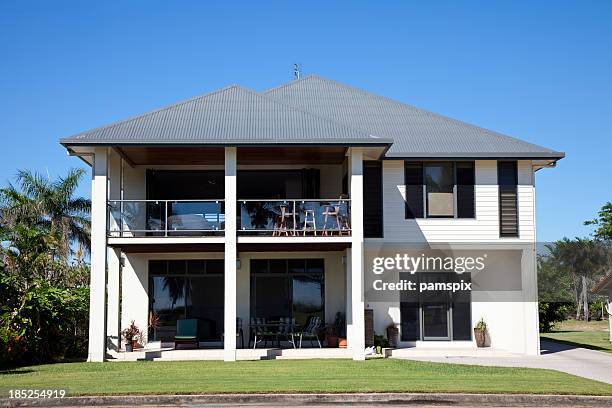 beachside home with blue sky - house with metal roof stock pictures, royalty-free photos & images