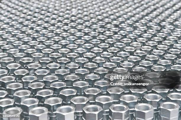 nuss-hintergrund - schraubenmutter stock-fotos und bilder