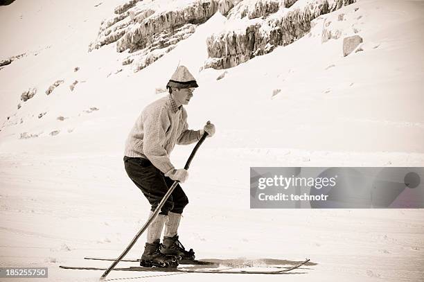 old style skier in the mountains - mens giant slalom stock pictures, royalty-free photos & images