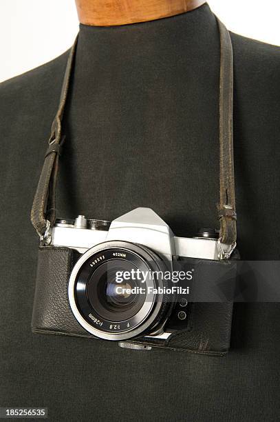 old reflex camera hanging on a mannequin - fabio filzi stock pictures, royalty-free photos & images