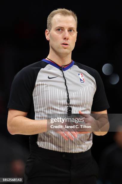 Referee Tyler Ricks looks on during the second half of the game between the Charlotte Hornets and the Miami Heat at Spectrum Center on December 11,...