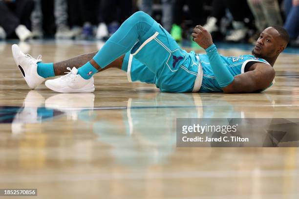 Terry Rozier of the Charlotte Hornets falls to the court after an attempt to tie the game with a half court buzzer-beater during the second half of...