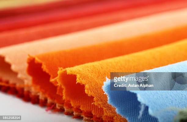 textilindustrie - orange silk background stock-fotos und bilder
