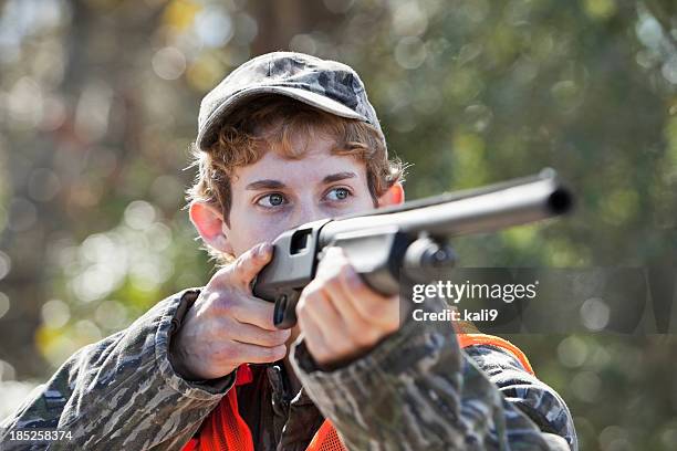 young man hunting - hagelgevär bildbanksfoton och bilder