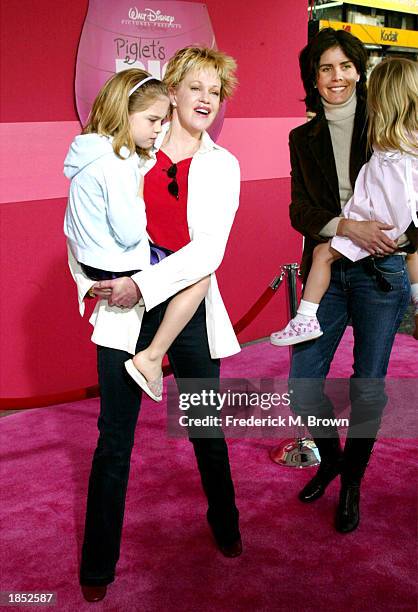 Actress Melanie Griffith , Don Johnson's wife, Kelley Phleger and kids attend the film premiere of "Piglet's Big Movie" at the El Capitan Theater on...