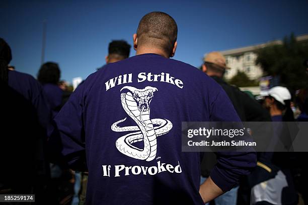 Bay Area Rapid Transit worker wears a strike shirt during a rally in front of the Lake Merritt BART station on the first day of the BART strike on...