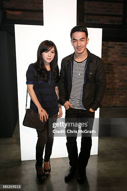Juwita Liana and Joe Taslim attend the Burberry Brit Rhythm Men gig at 28 Lorong Ampas in Singapore on October 18, 2013 in Singapore.